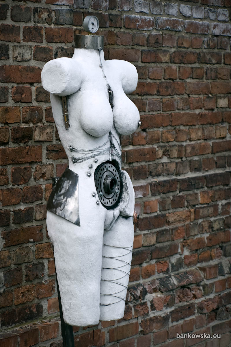 Female torso sculpture investigating technological control, energy overload, and the transformation of the human body.