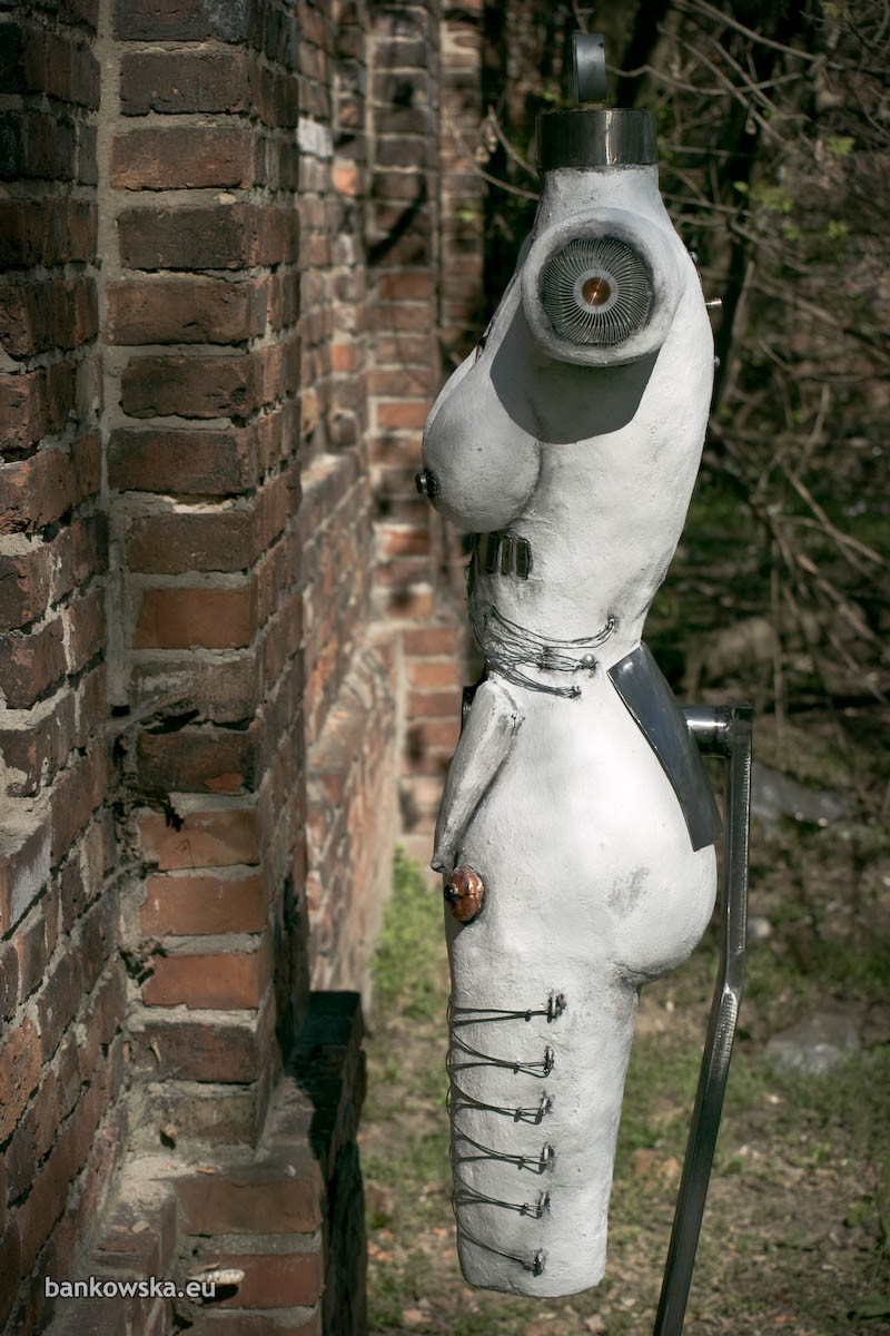 Mixed media female torso sculpture with wires and ports